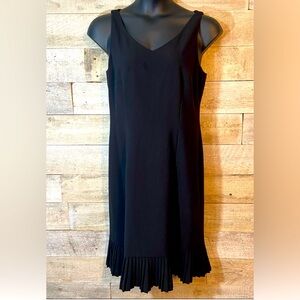 Black dress with pleated hem